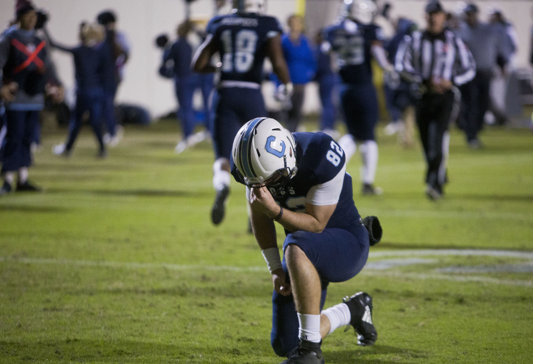 Brandon Rainey prays.JPG (copy)